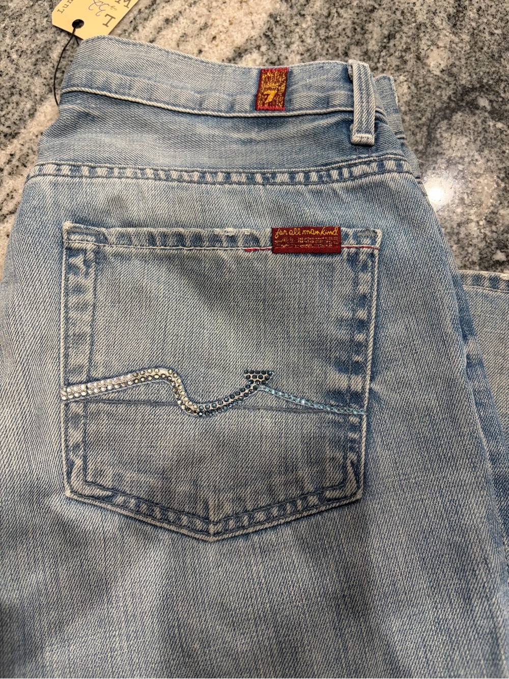 7 For All Mankind Light Blue Boot Cut Jeans with Rhinestone Back Pocket